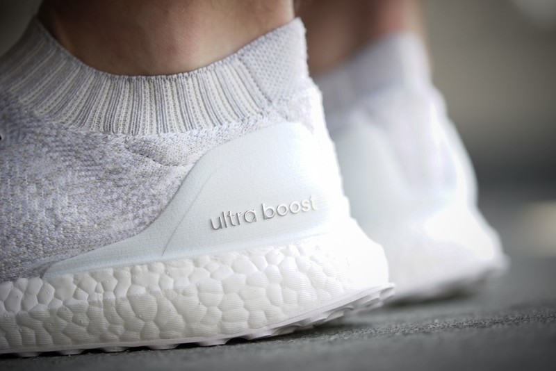 Ultra boost uncaged outlet triple white on feet